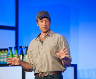 TV star Mike Rowe on stage at corporate event